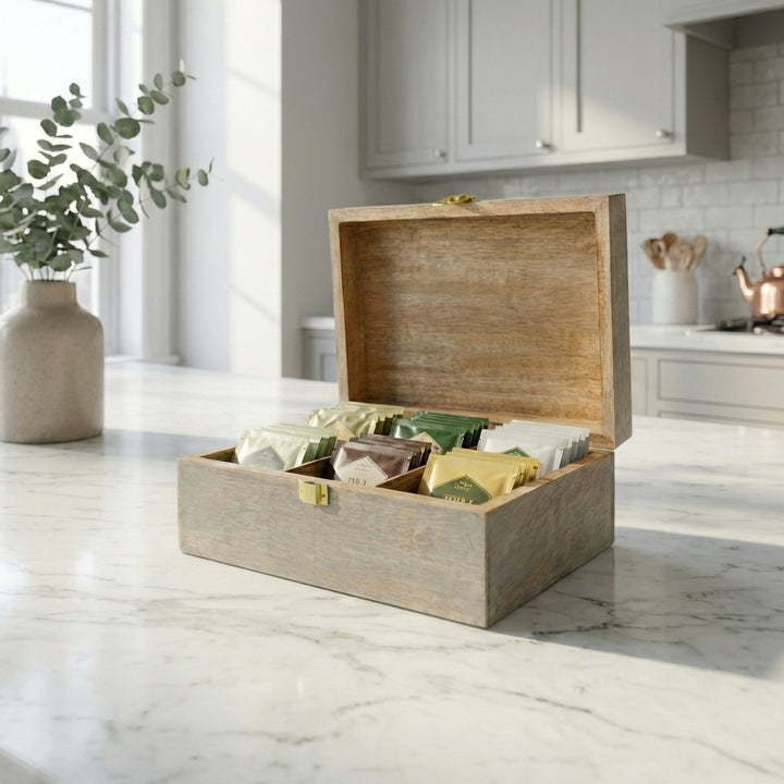 6 compartment handcrafted mango wood memory box styled on kitchen counter with teabags and small sachets