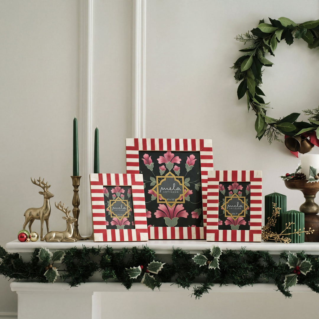 Candy cane red and white bone inlay picture frame displayed on a festive holiday mantelpiece