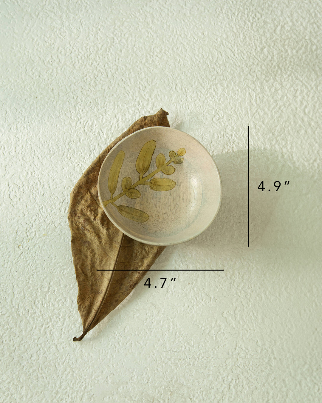 close-up of floral hand painted design on bowl
