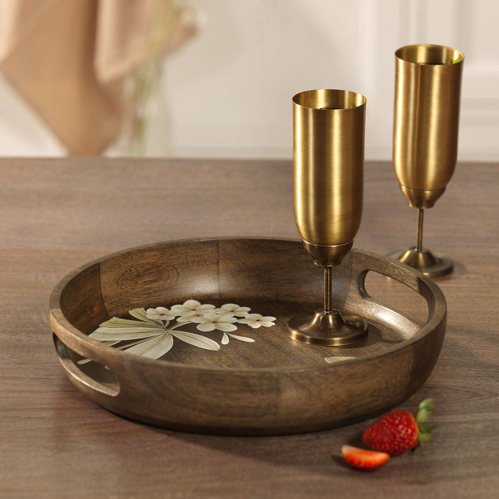 Frangipani tray styled on table with snacks and décor accents