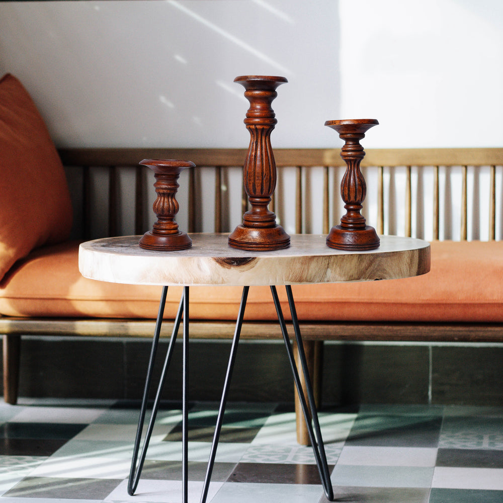 close-up of polished finish and wood grain on candleholders

