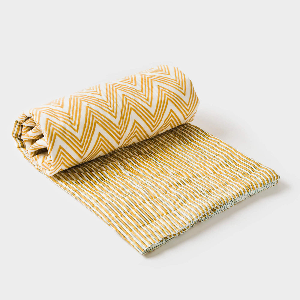 Yellow cotton handcrafted throw displayed neatly