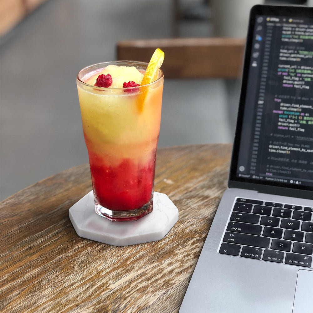 Marble coasters styled with drinks on tabletop